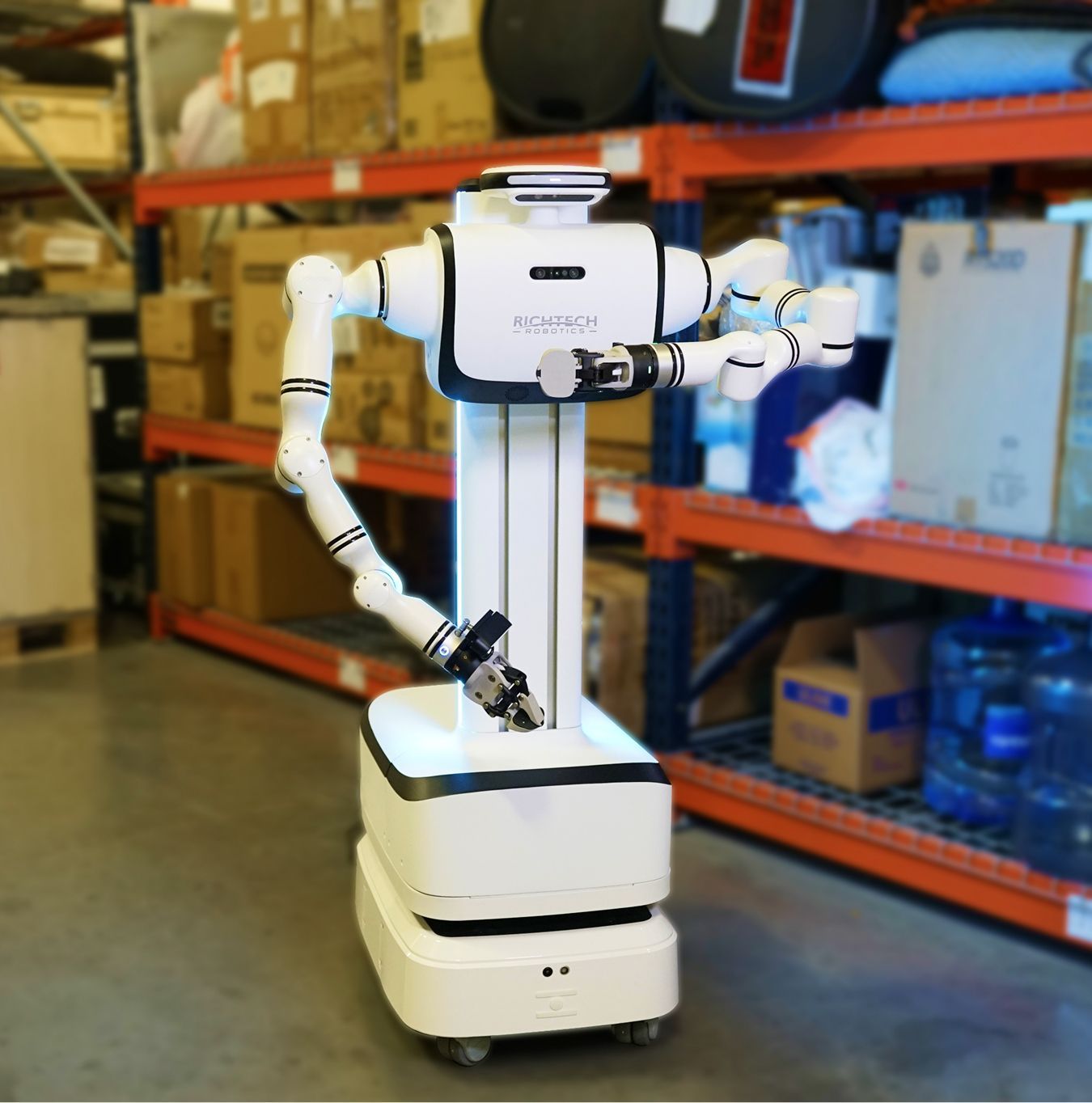 Richtech Robotics Dex wheeled humanoid robot, mobile platform in a warehouse aisle, front three-quarter view, vendor product photo