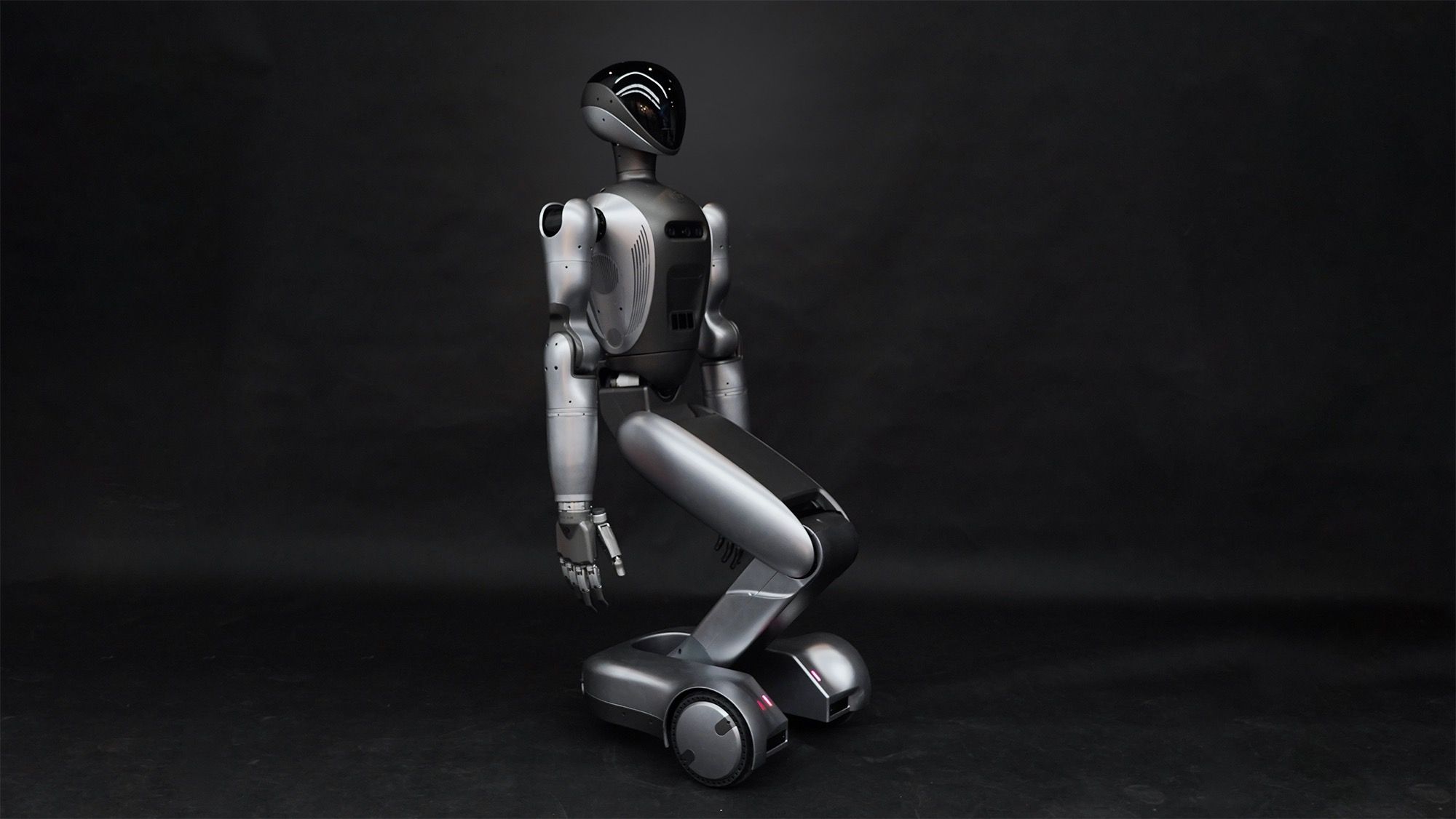 Yue Quan Bionics W-Bot 2.0 wheeled humanoid robot lowered pose, three-quarter view, vendor product photo