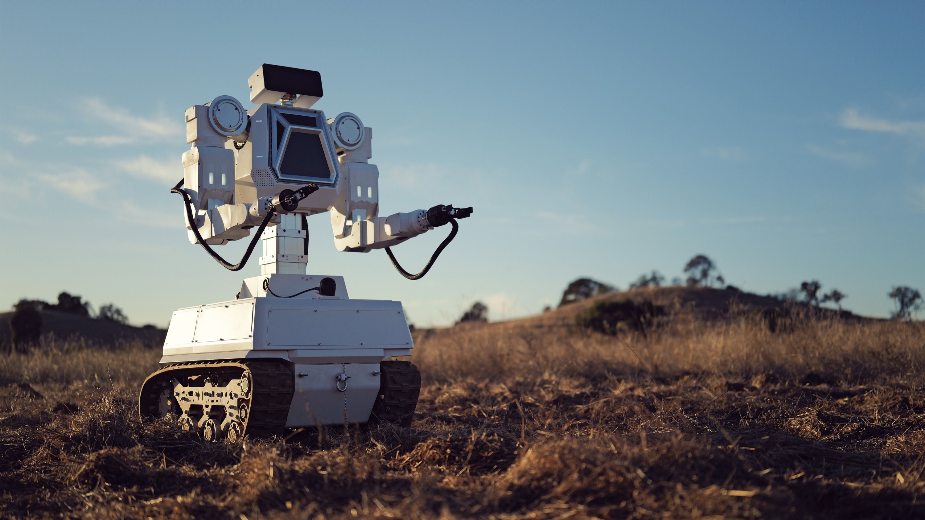 RoboForce TITAN dual-arm robot on tracked base with both arms extended, front three-quarter view, vendor product photo